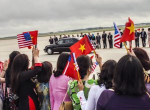 A crowd of roughly 120 people, mostly Vietnamese-Americans waving flags of both countries, and some dressed in traditional Vietnamese attire, attend the arrival of Nguyen Phu Trong, general secretary of Vietnam's Communist Party, at Joint Base Andrews, Md., July 6, 2015. Trong is scheduled to meet with President Obama July 7, which will be the first visit at the White House since the two countries normalized relations about 20 years ago. (U.S. Air Force photo by Senior Master Sgt. Kevin Wallace/RELEASED)
